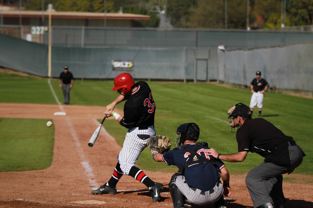 February 03, 2015 | Palomar baseball player #33 Francis Christy swings at a pitch during the second inning. The Comets hosted visiting Orange Coast College Tuesday afternoon at Meyers Field. The Comets ranked #2 in the state defeated the #1 ranked Pirates 4-3. Philip Farry / The Telescope
