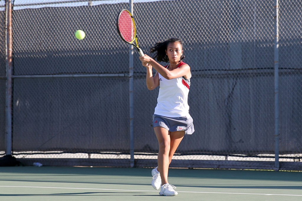 February 10, 2015 |   (NAME) returns a backhand in her match against Grossmont on February 10. The Comets lost the match 7-2. Photo by Hugh Cox (can we use his?)