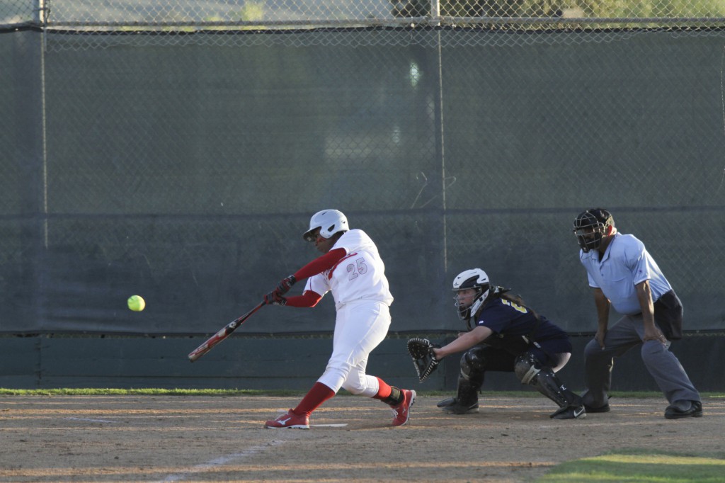 February 11, 2015 | Palomar third baseman Iesha Hill (25) connects with a pitch for one of her two hits on the day as the Comets beat the Olympians 12-2, improving their record to 7-1-1 (1-0 PCAC). Photo by Philip Farry / The Telescope