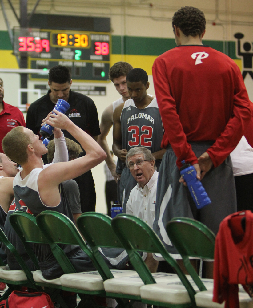 Palomar men's basketball head coach, John O'Neill, talks to his team during a timeout with the Comets trailing the Griffins by one point during the Feb. 18 away game at Grossmont College. Comets beat the Griffins with a final score of 69-57. (Dirk Callum/The Telescope)