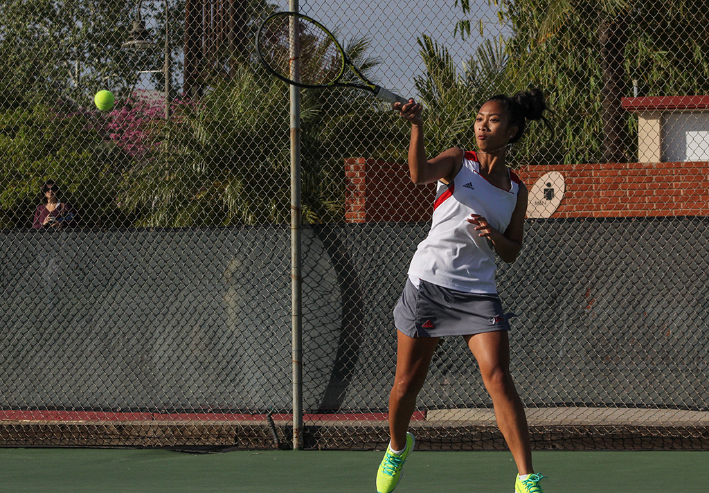 Palomar's Christina Nguyen returns the ball during her Singles match against San Diego Mesa College at the Palomar Tennis Courts on Feb 26. Nguyen won both her Singles and her Doubles matches. Dirk Callum/The Telescope