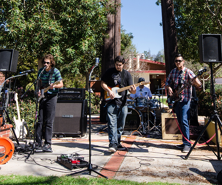 The Bawdry Brother; Jimmy Garcia (lead vocals), Steven Garcia (rhythm guitar), Angel Linares (bass) and Andres Berdeja (drums), playing a show on Palomar campus during the National Adjunct Week Teach-in, Feb. 25, 2015. (Evan Cast/The Telescope)