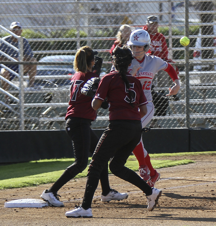 Palomar’s Maci Lerno (12) beats out an infield hit during the second inning against San Diego City College. The Comets ranked #4 in the state beat the visiting Knights Wednesday on March 4, 2015, 12-0 in five innings and improved their record to 14-1-1 (6-0 in conference play). (Philip Farry/The Telescope)