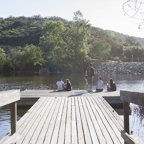 Visitors at Lakeview Park in San Marcos explore the small dock that juts out into Discovery Lake. Claudia Rodriguez/The Telescope