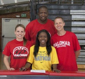 Palomar's Lee Lee Tomlinson (center) with Head Coach Leigh Marshall, Assistant Coach Damian Cephas, and Assistant Coach Chris Kroesch on April 8 in The Dome prior to signing her letter of intent to Presentation College. Tomlinson will be attending Presentation, located in Aberdeen South Dakota, on a basketball scholarship. Stephen Davis/The Telescope