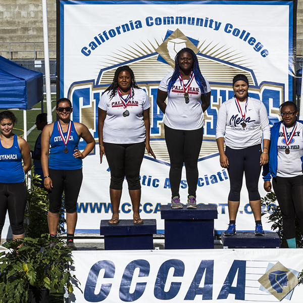 Palomar’s De’ondra Young (center) and Samone Everett (third from left) finished first and second in the hammer throw and shot put. Everett took first place in the discus and Young finished second during the Pacific Coast Athletic Conference Track and Field Championship held April 18 at Mesa College, San Diego Calif. Philip Farry/The Telescope.