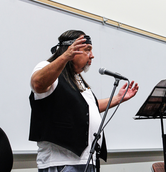 Author Gordon Johnson shares his reaction during a reading Thursday at the Annual Indian Day Celebration. Sept. 2015. (Hanadi Cackler/The Telescope)