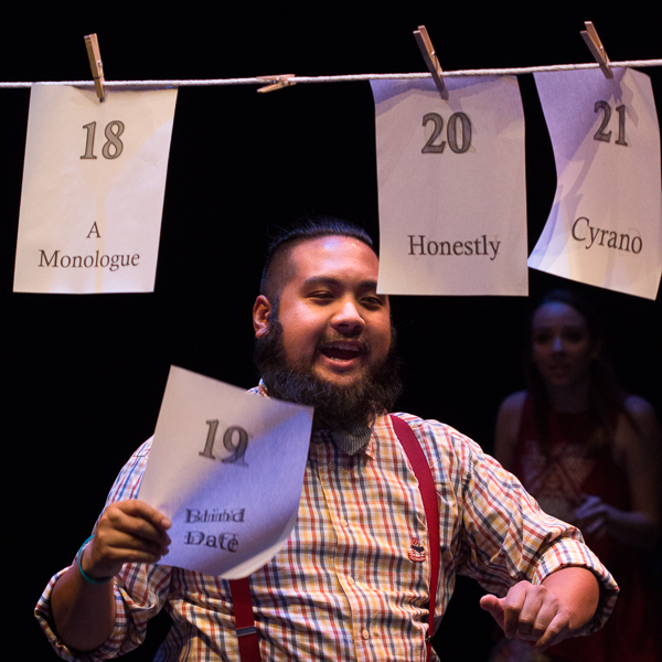Bayani Decastro, Jr. picks the next play to perform as called out by the audience at a dress rehearsal Thursday evening at Palomar College Nov. 12, 2015. (Patty Hayton/The Telescope)