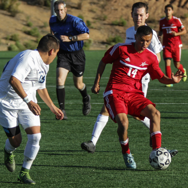 Palomar’s Juan Garcia keeps control of the ball during the first half against visiting MiraCosta College on Minkoff Field Nov. 13. The Comets defeated the Spartans 2-1 in their final game and improved their record to 9-12 (5-7 PCAC). Philip Farry / The Telescope