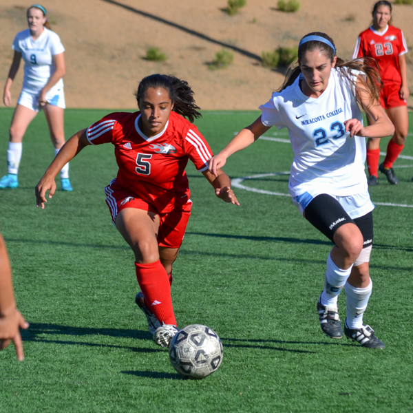 Palomar defender Alexis Tietjen (5) battles for the ball against a MiraCosta player on Minkoff Field Nov. 13. The Comets won 1-0. Kari Clarke/The Telescope