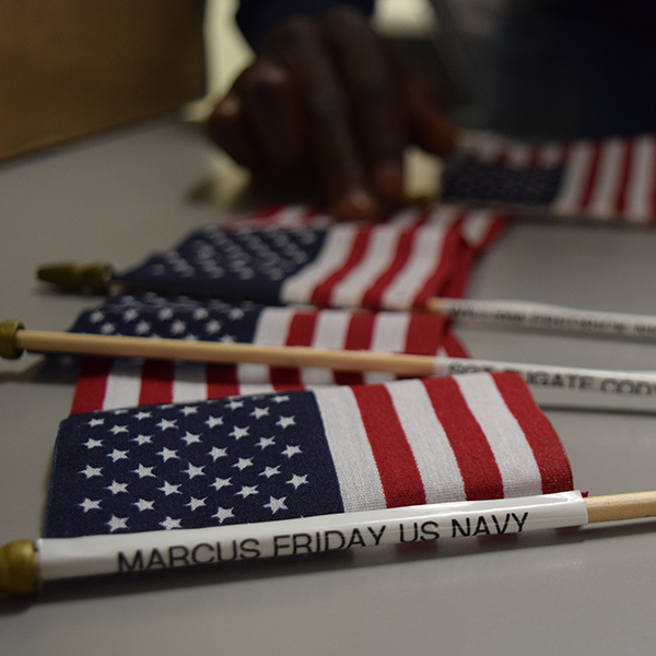 Flags bought by students to honor Veterans for Veterans Day. These will be placed in the quad lawn on Nov. 10, 2015 at 10 a.m. by the flag pole. Students purchased flags and personalized them with the name of their hero. (Kari Clarke/The Telescope)
