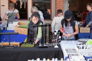 (L-r) Local supporter, Joanna Faulkner and art technology student, Desiree Seng, check out some of the hand-made jewelry on display during the Palomar Art Department's Student Art Sale. The three-day event ran from Dec. 2 through Dec. 5. Claudia Rodriguez/The Telescope