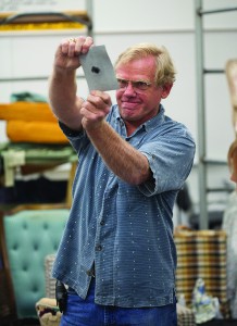 September 21, 2013. Professor James Duvall demonstrates the strength of a repaired piece of vinyl material during his Basic Upholstery class. Stephen Davis/The Telescope