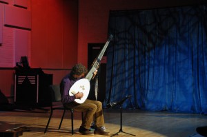Dominic Schaner tests the lighting and warms up pre-performance with his lute at Palomar February 18 Aaron Fortin/The Telescope