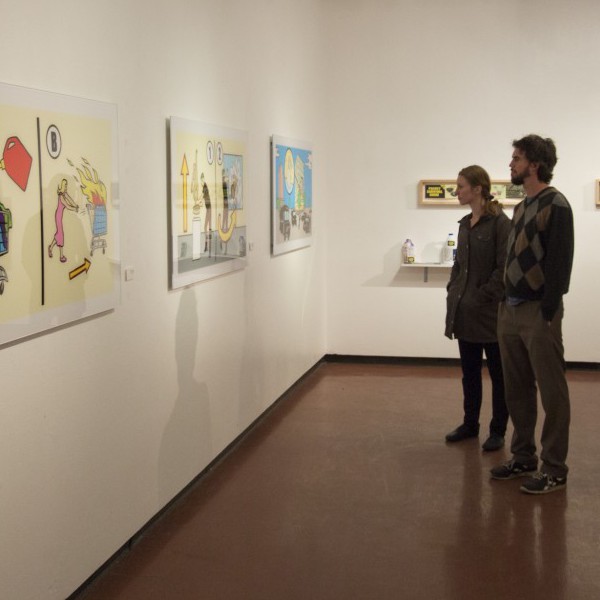 Paul Akers and Kathryn Poindexter look at Artists Packard Jennings print “Welcome to Geneva!” at the Palomar’s college Boehm Gallery during The Art of Dissent reception on Mar 29,2016. Packard Jennings is an American artist who incorporates pop culture figures and printmaking in his art work. Sergio Soares/ The Telescope.