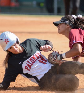 Palomar's Kealani (Nani) Leonui (#16) slides safely into 3rd base colliding with San Diego City College Knights infielder Alyssa Garrette (#11) during the March 30 game. Palomar won at home 9-0. Tracy Grassel/The Telescope