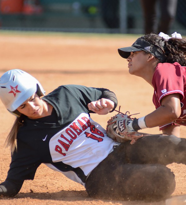 Palomar's Kealani (Nani) Leonui (#16) slides safely into third base colliding with San Diego City College Knights infielder Alyssa Garrette (#11) during the March 30, 2016 game. Palomar won at home 9-0. (Tracy Grassel/The Telescope)