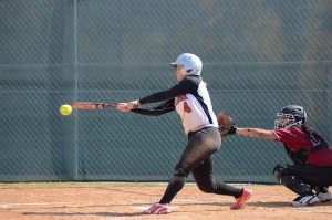 Palomar's Brooke Huddleson (#4) bangs out a double on her home-field during the March 30 game against the San Diego City College Knights. Palomar won 9-0. Tracy Grassel/The Telescope