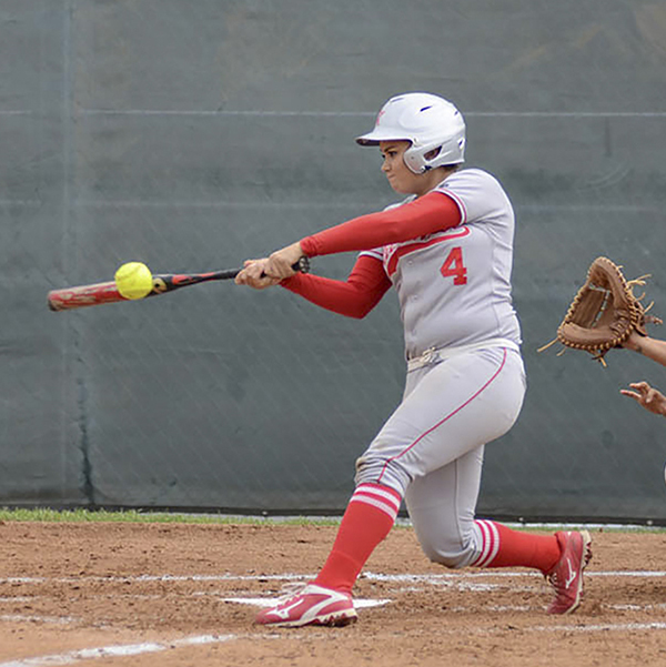 Palomar short-stop Brooke Huddleson (4) singles to left field in the bottom of the 5th inning against Grossmont College on April 8, 2016. The Comets won 11-3 over the Griffins. (Tracy Grassel/The Telescope)