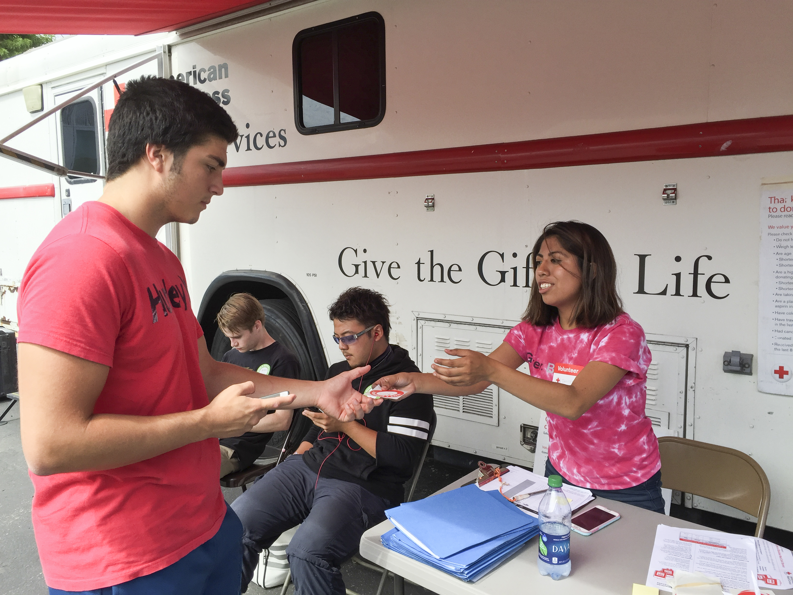 Red Cross volunteer Denisse Sanchez prepares Landon Raster for donating blood during the Palomar College Blood Drive on Tuesday Sept. 22, 2015 in Parking Lot 6. The Blood Drive is through Sept 25 and is sponsored by the Health Services Center. Each donation saves three lives. (Yvette Monteleone/The Telescope)