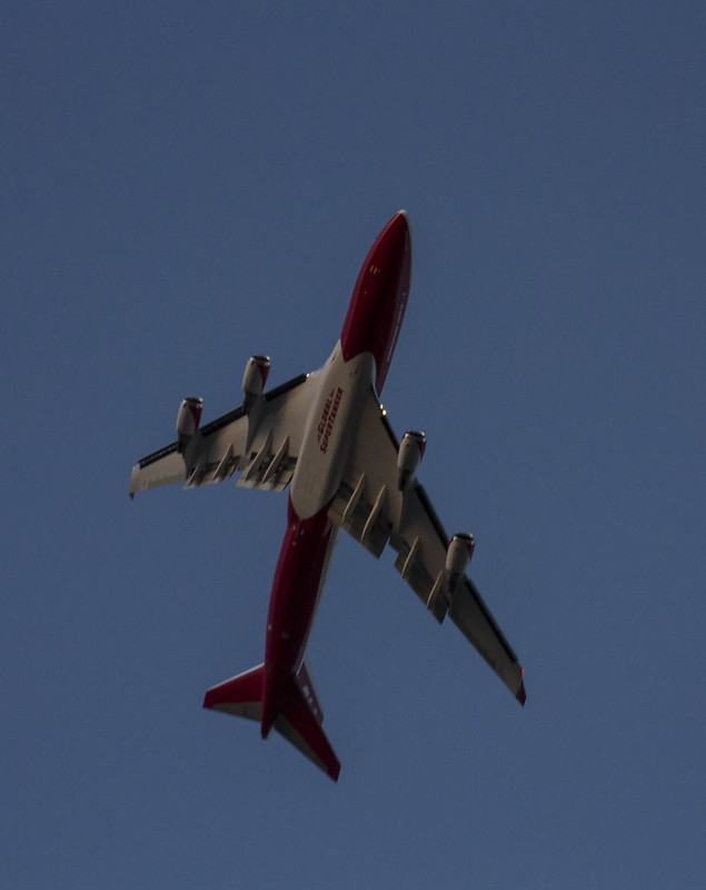The underbelly of a Supertanker 747 flying overhead.
