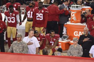 San Francisco 49ers quarterback Colin Kaepernick (7) and Eric Reid (35) kneel down during the playing of the national anthem before their NFL game on Monday, Sept. 12, 2016 at Levi&apos;s Stadium in Santa Clara, Calif. (Jose Carlos Fajardo/Bay Area News Group/TNS)