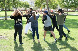 Self defense instructor Chris Brant demonstrates self defense moves during a self defense workshop in the Quad grass during PTSD and Domestic Violence Awareness Week on Tuesday, Nov. 3. 2015. ©Yvette Monteleone/The Telescope.