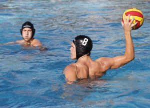 Palomar's Grant Curry (8) attempts to shoot a goal during the Men's Water Polo game between Palomar and Grossmont on Sept. 28 at the Wallace Memorial Pool. Teammate Eli Foli (back) looks on. Palomar men won 15-10. Coleen Burnham/The Telescope