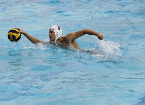 Palomar's Grant Curry (8) moves the ball toward goal during the Men's Water Polo game between Palomar and Mesa on Sept. 21 at the Mesa College Pool. Curry ended up shooting a goal with this possession. Palomar men won 24-12. Coleen Burnham/The Telescope