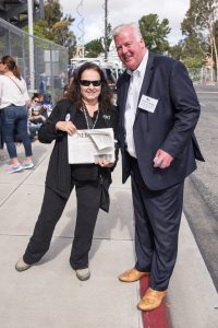 Nina Deerfield and Patrick Malloy pose while waiting in line to see Bernie Sanders at a rally in Vista on May 22, 2016.  Nina Deerfield is running for the Palomar College Board of Governors. Patrick Malloy is a Democratic candidate for the 50th congressional district running against Republican Duncan Hunter. Joe Dusel / The Telescope.