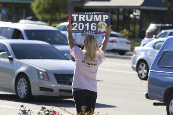 Donald Trump supporter were out raising their support signs on Ynez street in Temecula, CA. Oct 22, 2016. The overall response was mixed with occasional yelling, honking and obscene hand gestures. (Johnny Jones/The Telescope)