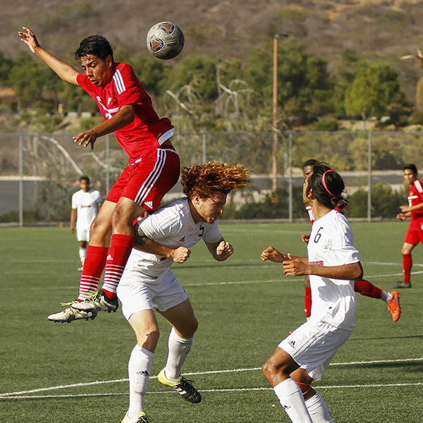 Palomar’s Luis Lopez gets airborne over San Diego City College defenders during the first half. The Comets hosted the Knights at Minkoff Field on Oct. 14, 2016 and won 2-1. The Comets record now stands at (3-8-3, 2-6-1 PCAC). (Philip Farry/The Telescope)