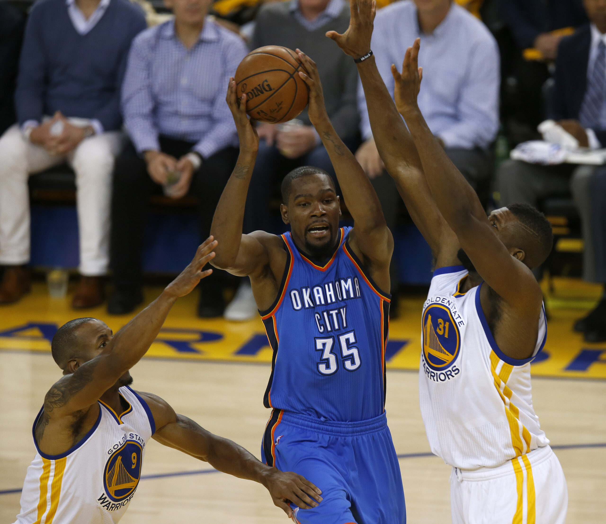 Oklahoma City Thunder's Kevin Durant (35) passes against Golden State Warriors' Festus Ezeli (31) in the second quarter of Game 1 of the NBA Western Conference finals at Oracle Arena on May 16, 2016 in Oakland, Calif. (Nhat V. Meyer/Bay Area News Group/TNS)