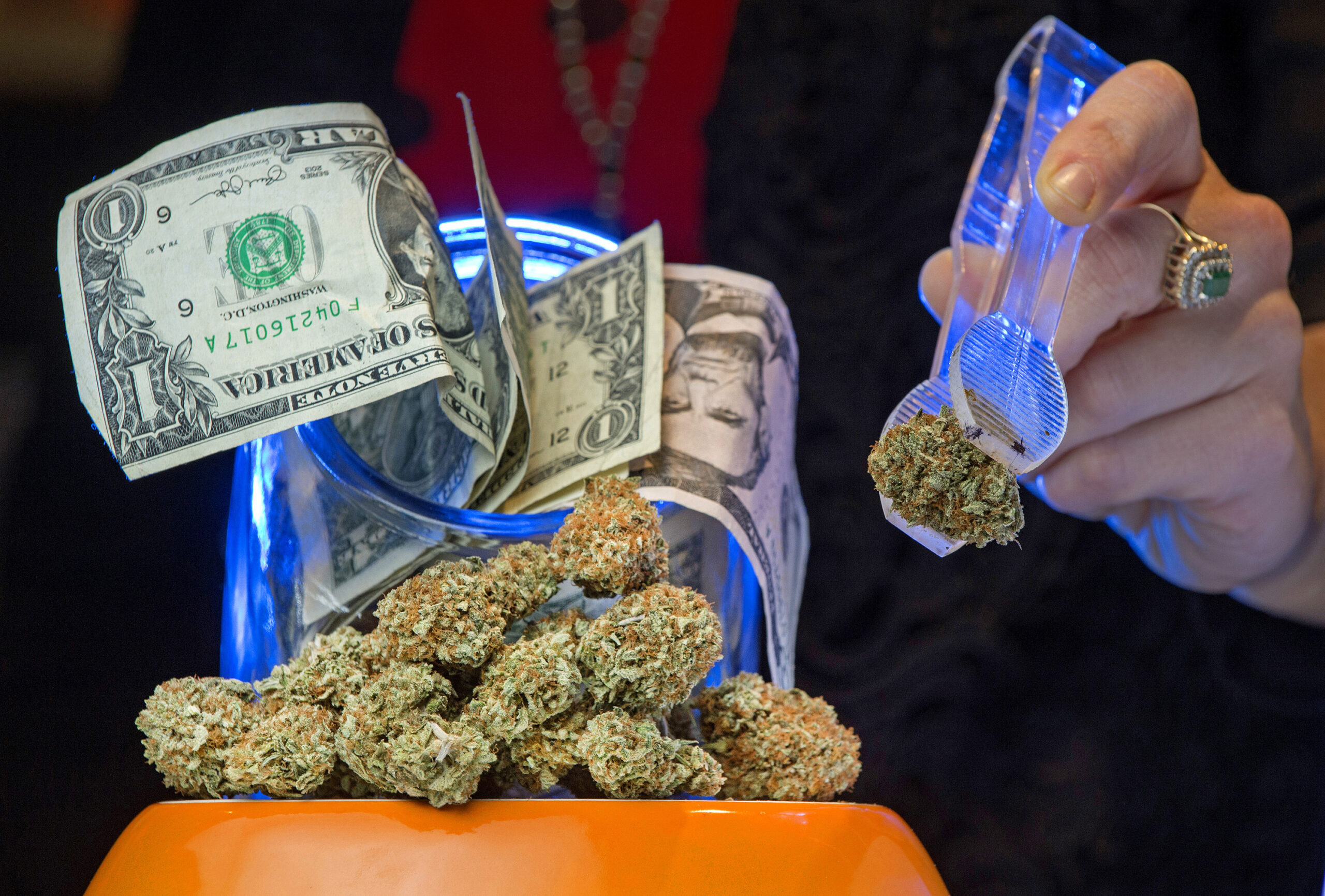 Though other ways to purchase are coming most of the transactions for purchasing pot in March at the OC3 Dispensary in Santa Ana was with cash. (Michael Goulding/Orange County Register/TNS)