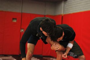 Brandon McCurdy and Robert Flores, wrestling during afternoon practice at Palomar Community College on Oct. 3. Idmantzi Torres/ The Telescope
