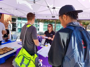 Michelle Muniz, Grand Canyon University transfer specialist, helps students during the annual Palomar College Fair. GCU was one of many schools that attended this event. Zachary Maxwell/The Telescope