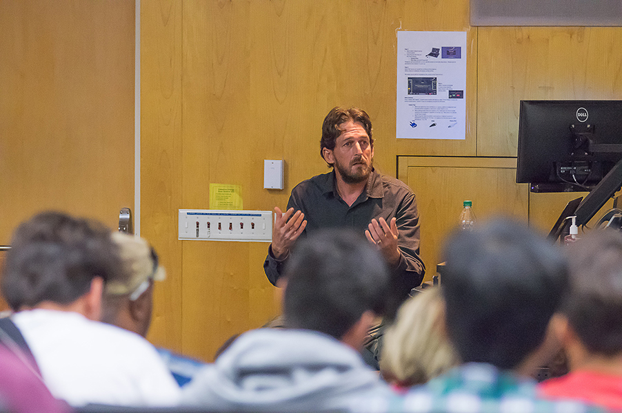 Photojournalist Matt Black, guest speaker for the Media Studies Open House, discusses his work in an auditorium at Palomar College on Nov. 14, 2016. (Joe Dusel/The Telescope)