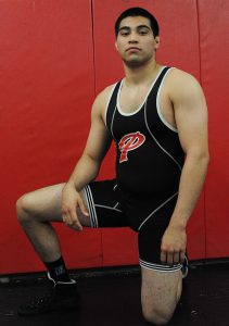 Palomar College wrestling team member Alex Gomez poses for a photo for the Fall 2016 season in at Palomar College, Nov. 18. Idmantzi Torres/ The Telescope.