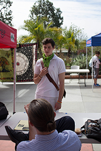 Gabe Thelen stops at a booth during club rush on Tuesday, Feb. 14, 2017 at the student union in Palomar College. The event is held to promote clubs and organizations on campus. David Santillan/The Telescope