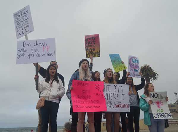 Thousands of peaceful demonstrators walk two miles through the streets of downtown Encinitas to show support for Planned Parenthood on Feb. 11, 2017. (Kathleen Coogan/The Telescope)