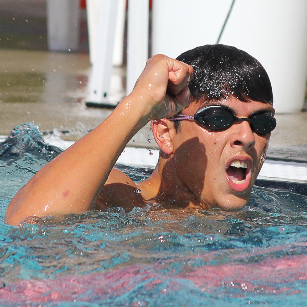 Palomar's Alexander Nider celebrates his win in the men’s 100-yard Freestyle at the swim meet between Palomar and Grossmont on March 17 at the Wallace Memorial Pool. Nider tied for first place with Nicco Birdsong with a time of 51.80. The men lost the meet overall with a score of 136.5 - 103.5. Coleen Burnham/ The Telescope