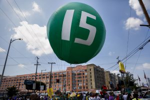 Workers march through downtown Los Angeles on April 14 to demand a nationwide $15-an-hour minimum wage. (Jay L. Clendenin/Los Angeles Times/TNS)