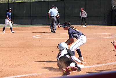 Palomar second base Bailey Romano (#7) slides into third after a solid hit from Palomar first base Moriah Lopez (#29) in the first inning of the April 21 game vs. San Diego Mesa. Palomar won 8-0.