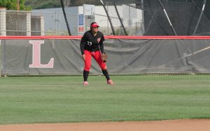 Palomar College Comets right field utility player, Tiare Paopao, waits for the pitch during the Comets game against the Southwestern College Jaguars on April 7, 2017 at Palomar College. The Comets beat the Jaguars 10-1 in six innings to remain undefeated in the Pacific Coast Athletic Conference. Kathleen Coogan/The Telescope