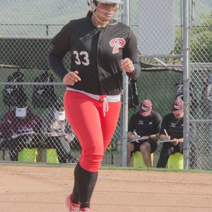 Palomar College Comets right field utility player, Tiare Paopao, returns to the dugout during the Comets game against the Southwestern College Jaguars on April 7, 2017 at Palomar College. The Comets beat the Jaguars 10-1 in six innings to remain undefeated in the Pacific Coast Athletic Conference. Kathleen Coogan/The Telescope