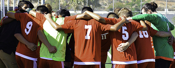 Palomar mens soccer team huddle together before the start of their match vs College of the Desert. Oct. 7, 2016 on Minkoff Field. (Dylan Halstead/The Telescope)