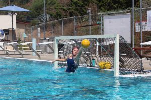 Women’s water polo goalie Jordann Heimbeck practices saving goals at the pool on Sept. 5. Justin Gonzalez/The Telescope