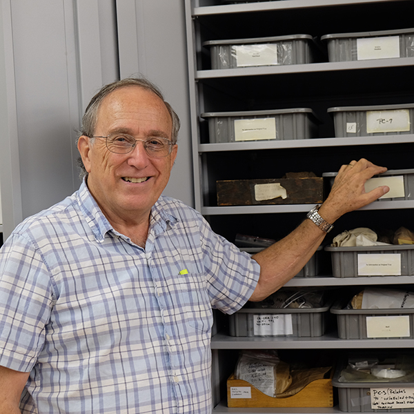 Dr. Philip DeBarros shows off trays full of artifacts collected and catalogued by himself and his students. Dr. DeBarros will retire in December after over 20 years at Palomar. (Scott Engrav/The Telescope)