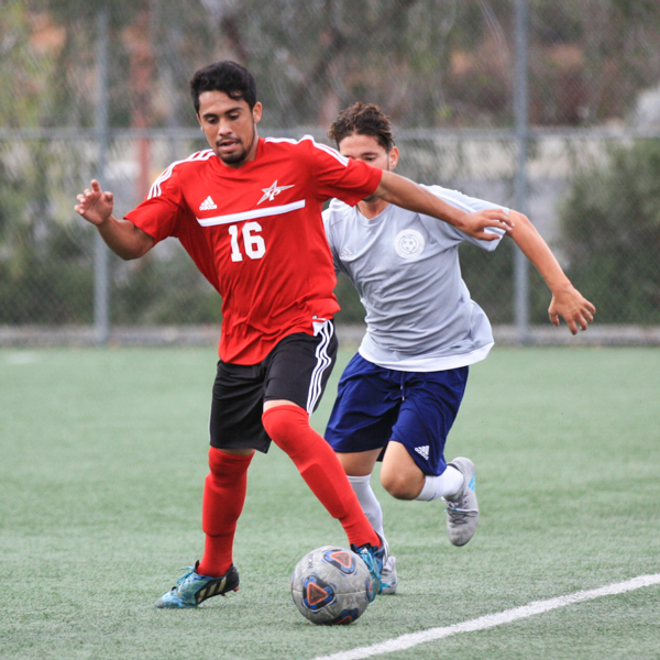 Palomar midfielder Joel Loera (16) prepares to kick the ball early in the first half of the game against San Diego Mesa on Oct. 20, 2017. Final score tied 2-2. (Alissa Papach/The Telescope)