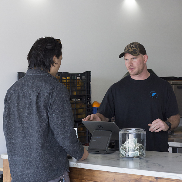 Bump coffee, Phil Lyon, helping a customer, Anthony Gonzalez , Apr. 16, 2018. (Taylor Hardey/The Telescope)